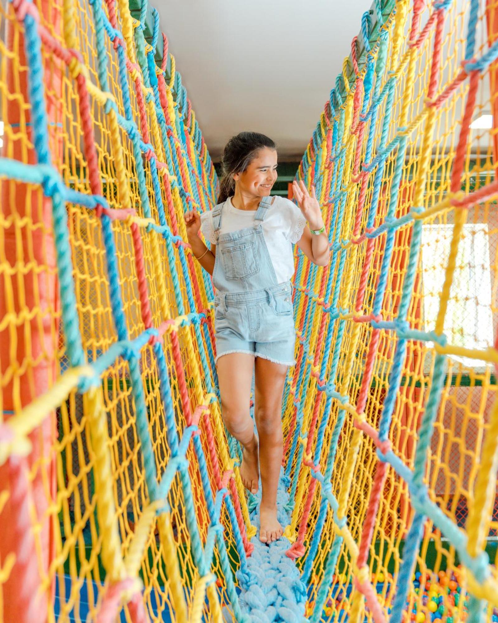Hard Rock Hotel & Casino Punta Cana (Adults Only) Εξωτερικό φωτογραφία A girl walking on a rope bridge